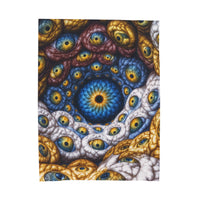 The Many Eyes of One Awareness — Velveteen Plush Blanket, 60 × 80 in — interwoven blue and gold eyes in ivory, ochre and mauve forms