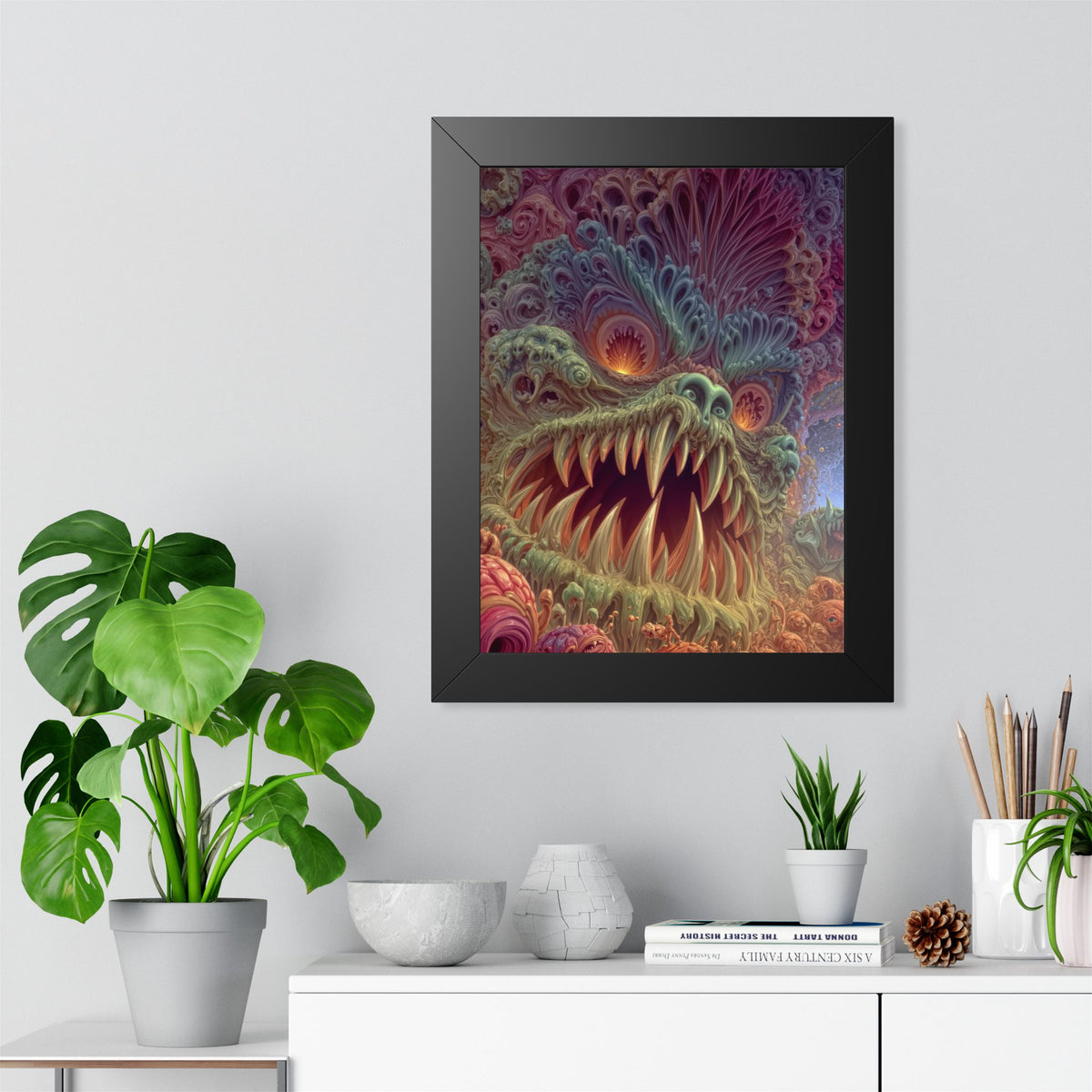 Where Fear Becomes a Passage — Black Framed Print, 12 × 16 in — fanged creature with glowing eyes amid sage and mauve organic forms